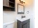 Bathroom with vanity, mirror, and updated fixtures at 1612 Fox Run Dr, Tarpon Springs, FL 34689
