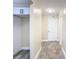 Bright entry hall with tile flooring and built-in shelving at 1612 Fox Run Dr, Tarpon Springs, FL 34689