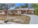 Updated 1-story home with new landscaping and driveway at 1612 Fox Run Dr, Tarpon Springs, FL 34689