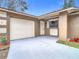 Attached garage with automatic door opener at 1612 Fox Run Dr, Tarpon Springs, FL 34689