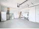 Garage with shelving, water heater, and door at 1612 Fox Run Dr, Tarpon Springs, FL 34689