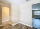 Clean and bright hallway with tile floors and neutral walls at 1612 Fox Run Dr, Tarpon Springs, FL 34689