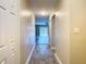 Renovated hallway with tile floors leading to the living area at 1612 Fox Run Dr, Tarpon Springs, FL 34689