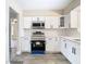 Modern kitchen featuring white shaker cabinets and new appliances at 1612 Fox Run Dr, Tarpon Springs, FL 34689