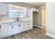 Newly remodeled kitchen with white cabinets and quartz countertops at 1612 Fox Run Dr, Tarpon Springs, FL 34689