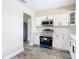 Modern white kitchen with stainless steel appliances at 1612 Fox Run Dr, Tarpon Springs, FL 34689