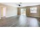Bright living room with vinyl plank flooring and access to backyard at 1612 Fox Run Dr, Tarpon Springs, FL 34689