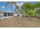 Spacious backyard with lush landscaping and a patio area at 1706 Kirtley Dr, Brandon, FL 33511