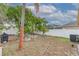 Large backyard with patio furniture and a grill at 1706 Kirtley Dr, Brandon, FL 33511