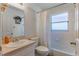 Clean bathroom with a shower/tub combo and a vanity at 1706 Kirtley Dr, Brandon, FL 33511