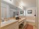 Bathroom with double sinks, tub, and shower at 1706 Kirtley Dr, Brandon, FL 33511