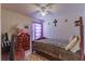 Spacious bedroom with a double bed, dresser, and purple curtains at 1706 Kirtley Dr, Brandon, FL 33511