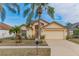 Charming single-story house with a large front yard and palm trees at 1706 Kirtley Dr, Brandon, FL 33511