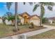 Single-story house with a two-car garage and tropical landscaping at 1706 Kirtley Dr, Brandon, FL 33511