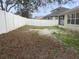 Large backyard with a white vinyl fence at 18916 New Passage Blvd, Land O Lakes, FL 34638