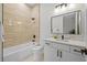 Spa-like bathroom with soaking tub, quartz vanity, and modern fixtures at 2549 Martha Ln, Land O Lakes, FL 34639