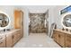 Spa-like bathroom with walk-in shower, double vanity, and large mirrors at 2549 Martha Ln, Land O Lakes, FL 34639
