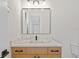 Elegant bathroom with quartz countertop, modern sink, and framed mirror at 2549 Martha Ln, Land O Lakes, FL 34639
