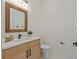 Modern bathroom with wood vanity, quartz countertop, and floating sink at 2549 Martha Ln, Land O Lakes, FL 34639