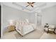 Bright bedroom with large bed and access to bathroom at 2549 Martha Ln, Land O Lakes, FL 34639