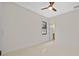 Simple bedroom with a window and access to a bathroom at 2549 Martha Ln, Land O Lakes, FL 34639