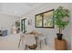 Bright dining area with wood table and four chairs at 2549 Martha Ln, Land O Lakes, FL 34639