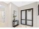 Spacious entryway with double doors and a simple console table at 2549 Martha Ln, Land O Lakes, FL 34639