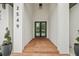 Modern front entry with double doors and terracotta tile flooring at 2549 Martha Ln, Land O Lakes, FL 34639