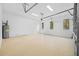 Bright and spacious garage with overhead door and ample space at 2549 Martha Ln, Land O Lakes, FL 34639
