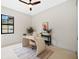 Modern home office with a unique desk and plenty of natural light at 2549 Martha Ln, Land O Lakes, FL 34639