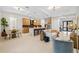 Open floor plan with modern kitchen, island, and living room at 2549 Martha Ln, Land O Lakes, FL 34639