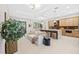 Open living room and kitchen with light and airy feel at 2549 Martha Ln, Land O Lakes, FL 34639