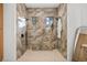 Large walk-in shower with marble tile and two shower heads at 2549 Martha Ln, Land O Lakes, FL 34639