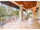 Large balcony with rocking chairs and street view at 310 8Th N Ave, St Petersburg, FL 33701