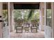 Relaxing balcony with rocking chairs and view of trees at 310 8Th N Ave, St Petersburg, FL 33701