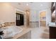 Spa-like bathroom with a large soaking tub, walk-in shower, and double vanity at 310 8Th N Ave, St Petersburg, FL 33701