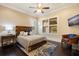 Guest bedroom with a comfortable bed and dark hardwood floors at 310 8Th N Ave, St Petersburg, FL 33701