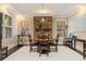 Elegant dining room with stone fireplace and hardwood floors at 310 8Th N Ave, St Petersburg, FL 33701