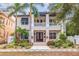 Two-story house with double front doors, landscaping, and walkway at 310 8Th N Ave, St Petersburg, FL 33701