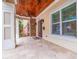 Front porch with wood ceiling, tile floor, and double doors at 310 8Th N Ave, St Petersburg, FL 33701