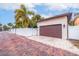 Attached garage with automatic door opener and brick driveway at 310 8Th N Ave, St Petersburg, FL 33701