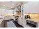 Modern kitchen features stainless steel appliances and white cabinetry at 310 8Th N Ave, St Petersburg, FL 33701