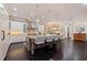 Open concept kitchen with island, white cabinets, and stainless steel appliances at 310 8Th N Ave, St Petersburg, FL 33701