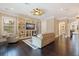 Spacious living area featuring hardwood floors, built-in shelving, and a cozy seating arrangement at 310 8Th N Ave, St Petersburg, FL 33701