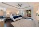 Serene main bedroom offering a king-size bed, private balcony access, and plenty of natural light at 310 8Th N Ave, St Petersburg, FL 33701