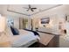Luxurious main bedroom boasting a king-size bed, elegant decor, and access to a private balcony at 310 8Th N Ave, St Petersburg, FL 33701