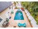 Aerial view of a rectangular pool with surrounding patio and lounge chairs at 310 8Th N Ave, St Petersburg, FL 33701