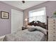 Cozy bedroom with a wooden bed frame and neutral decor at 3401 W Paris St, Tampa, FL 33614