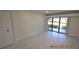 Bright bedroom with sliding glass doors to a patio at 36750 Us Highway 19 N # 23120, Palm Harbor, FL 34684