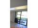 Room with sliding glass doors leading to patio at 36750 Us Highway 19 N # 23120, Palm Harbor, FL 34684